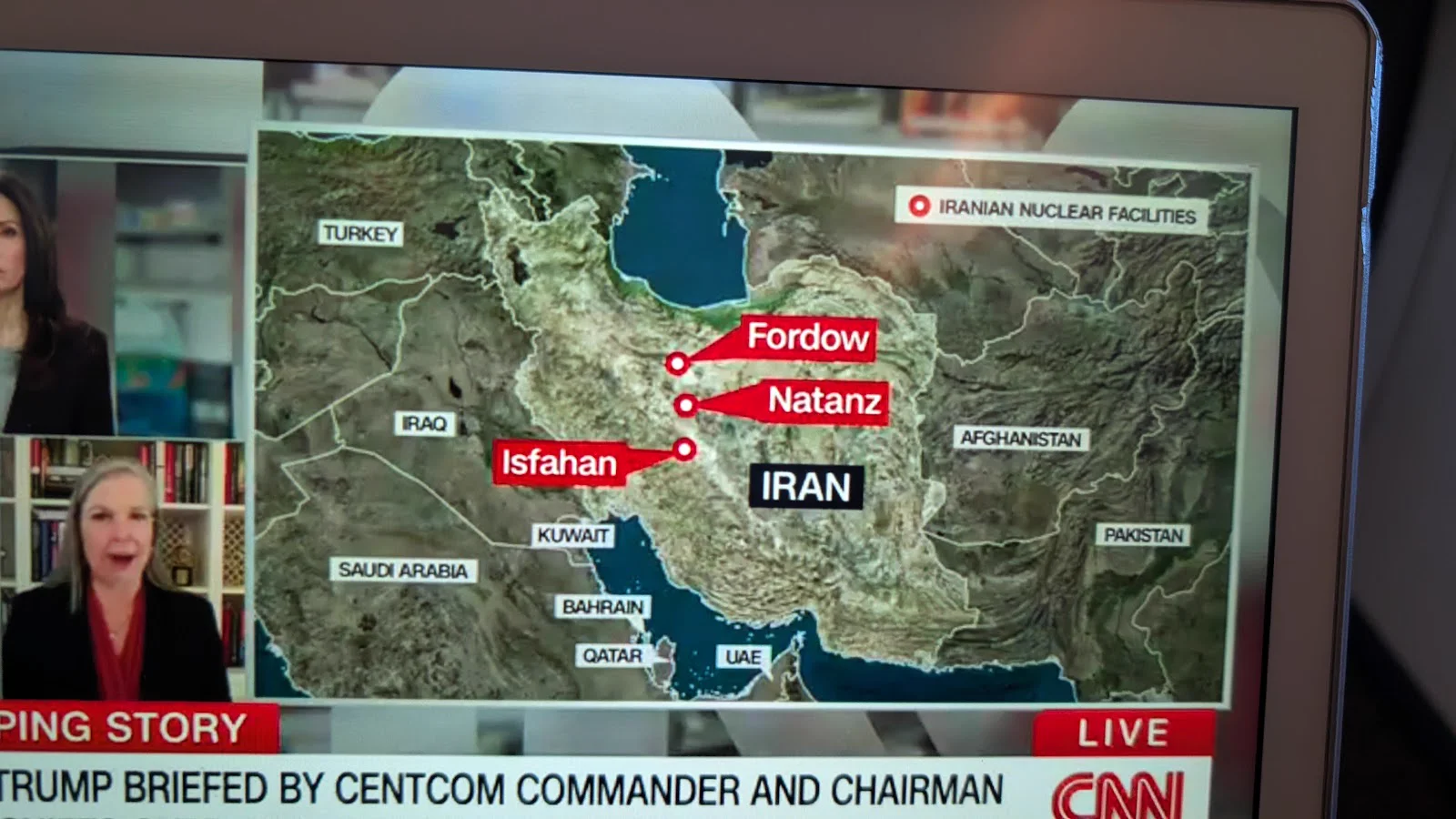 Live CNN on seatback screen: Trump Briefed by CENTCOM Commander with map of Iranian Nuclear Facilities including Fordow, Natanz, and Isfahan